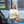 Load image into Gallery viewer, Woman standing in front of the Gower Brewery bus wearing yellow Gower Brewery T-shirt

